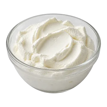 A small glass bowl of plain fresh cheese