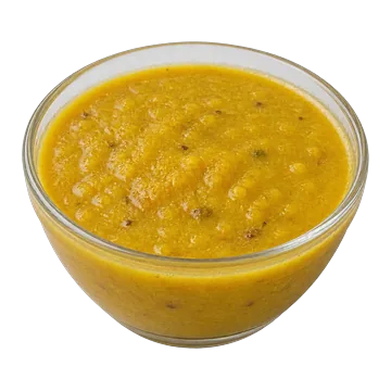 A small glass bowl of lentil dal